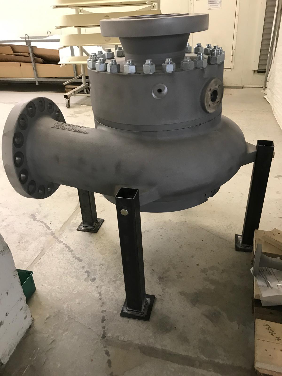 Blasted pump housing with grey primer on steel supports